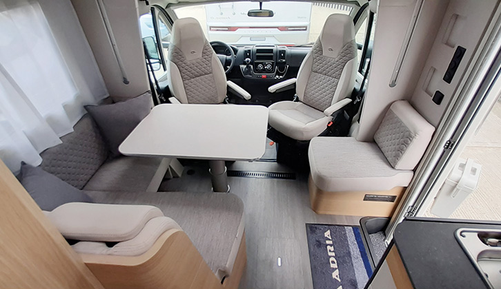 Swivel the cab seats to face the settee and two travel seats, and you get a very comfortable lounge