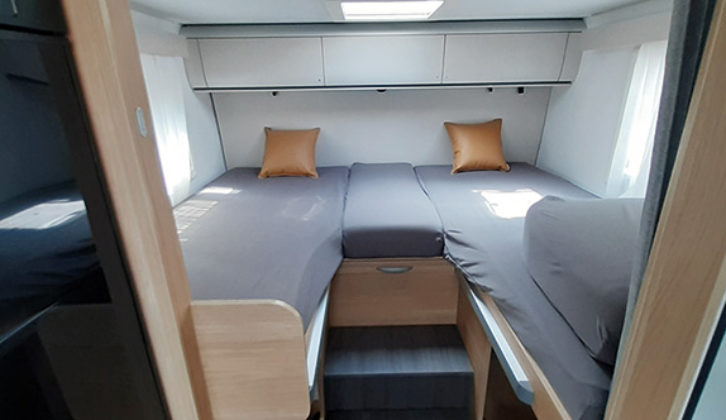 Single beds at the rear are 2m long, and easily convert to make up a huge double if you prefer