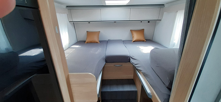 Single beds at the rear are 2m long, and easily convert to make up a huge double if you prefer