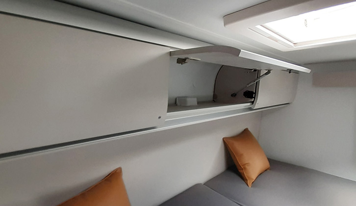 Dark-grey upholstery complemented by bright caramel scatter cushions