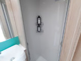 The shower has decent headroom but only a single plughole