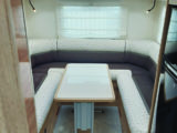 Foldaway table in the spacious rear lounge is stored in wardrobe