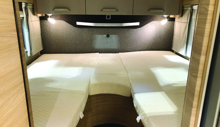 Double bed at the rear of the vehicle has storage beneath