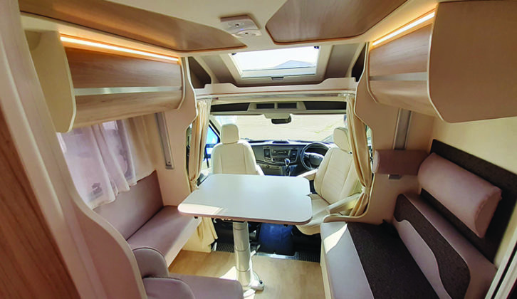 Swivel the cab seats to face the table in the front lounge for comfortable dining