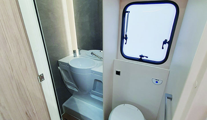 Washroom houses a rain shower, mirror and handbasin