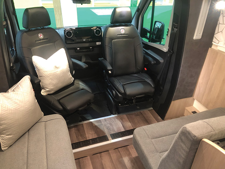 Both leather-clad cab chairs swivel to join the rear seats, and the addition of the freestanding table makes a roomy area for relaxing and dining 