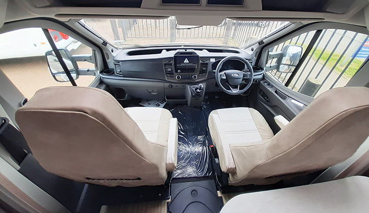 Standard Ford cab interior with drinks holders in the corners