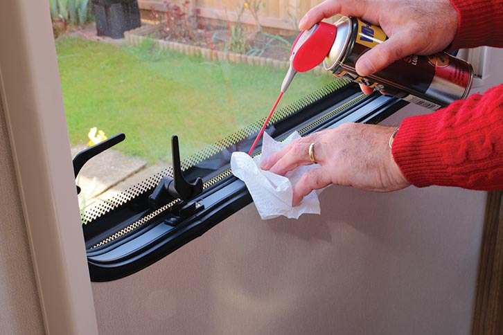 Silicone lubricant being sprayed where the window has stuck
