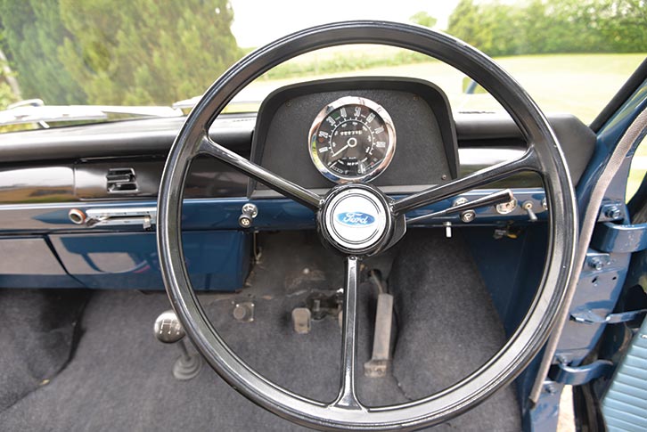 The steering wheel of a classic camper