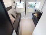 Rear lounge seating is restricted by the large cupboard to one side