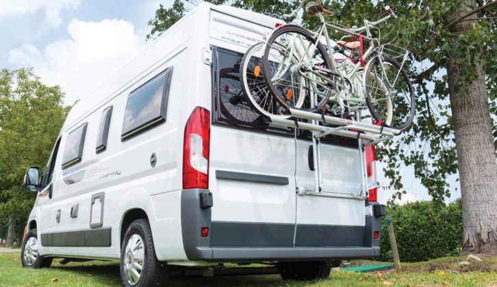 A bike rack attached to the rear of a motorhome