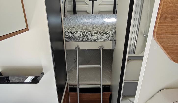 The ladder to the top drop-down bed