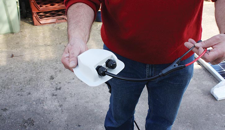 Feeding the cable through the roof lead-through