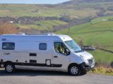 WildAx motorhome parked by fields