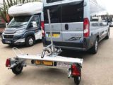 Compact trailer attached to a motorhome from Armitages