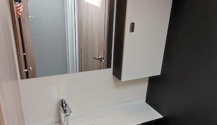 Washroom has sizeable basin and mirror