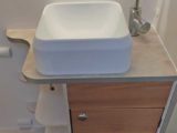 Swan-neck tap in washroom