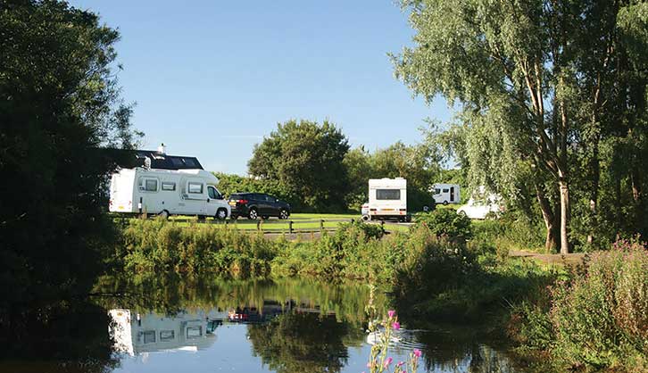Motorhome reflected in pond at Ballyness