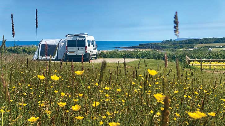 Campervan pitched up with sea view