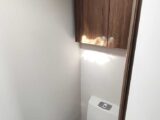 Toilet in corner washroom