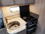 Kitchen with sink and cooker