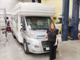 Person standing in front of motorhome
