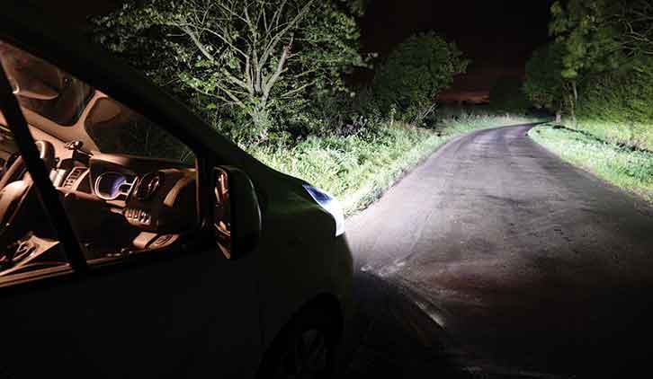 Headlights on dark road