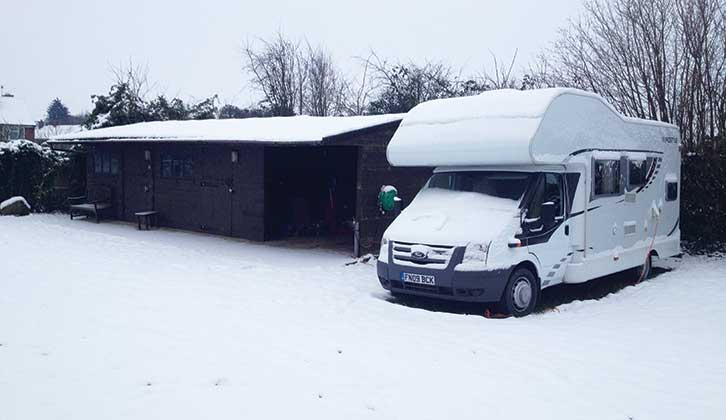 Motorhome covered in snow