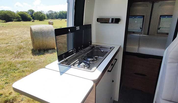 Kitchen with inline sink and hob