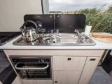 Kitchen with two-burner hob and sink, with separate oven/grill