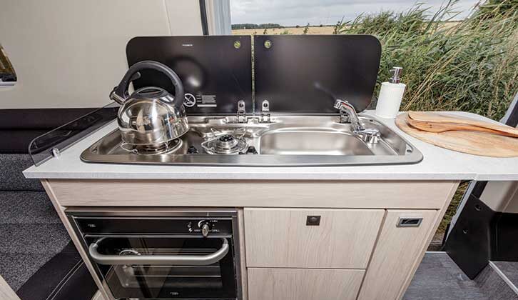 Kitchen with two-burner hob and sink, with separate oven/grill