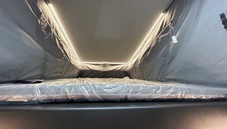 Upstairs bed with night-time lighting