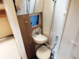 The toilet and basin in the washroom
