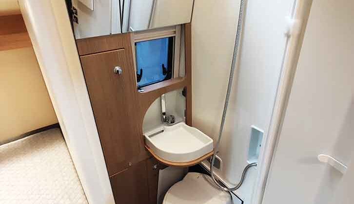 The toilet and basin in the washroom