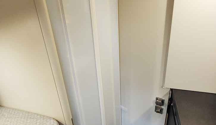 The shower cubicle sealed off with a screen