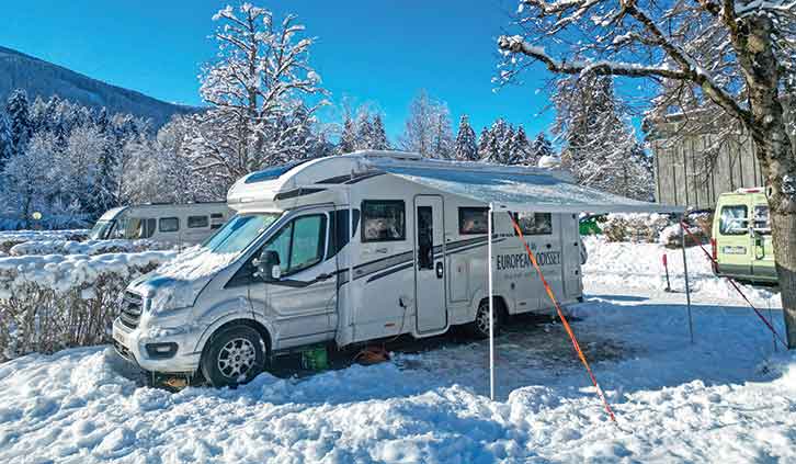 A motorhome pitched up in snow