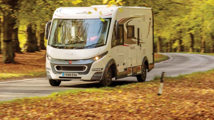An A-class motorhome being driven