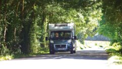 A motorhome being driven down a road