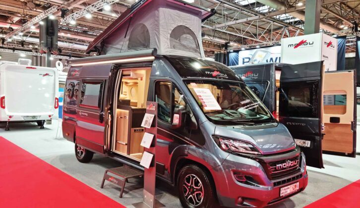 A Malibu campervan with its pop-top up
