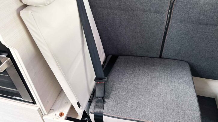 A side-facing seat changed to a forward-facing seat for travel