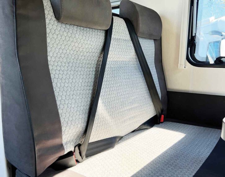 A front-facing seat with a three-point seatbelt
