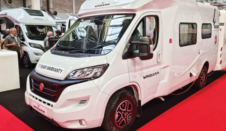 A Wingamm motorhome at a show with a 7 year warranty sticker on it