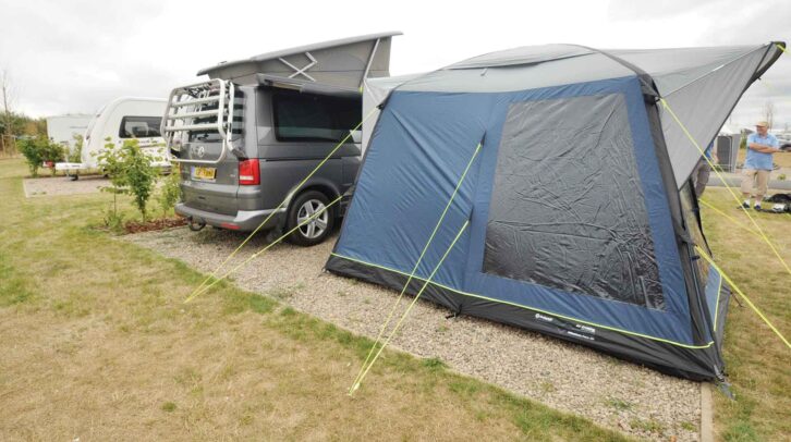 A VW campervan by a drive-away awning