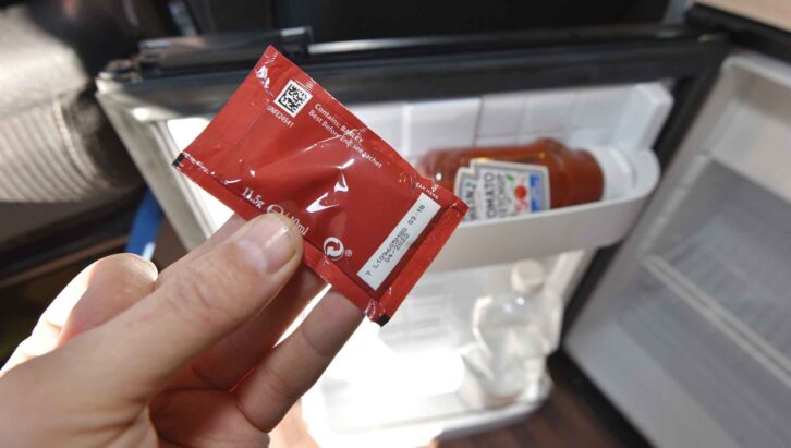 Checking a ketchup packet