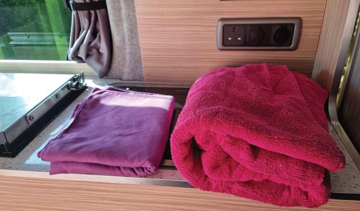 A microfibre towel next to a domestic towel