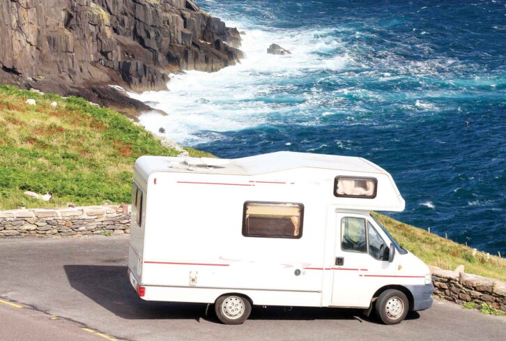 A van parked by a stretch of coast along the Wild Atlantic Way