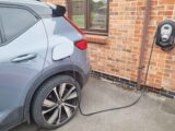 A car being charged at a home with a 7kW home charger