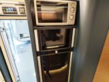 The microwave and fridge
