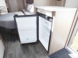 An under counter fridge with its door open