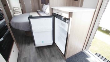 An under counter fridge with its door open